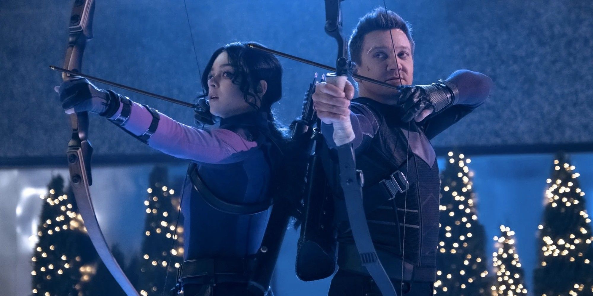 Kate Bishop and Clint Barton aiming their bows and arrows in Hawkeye.