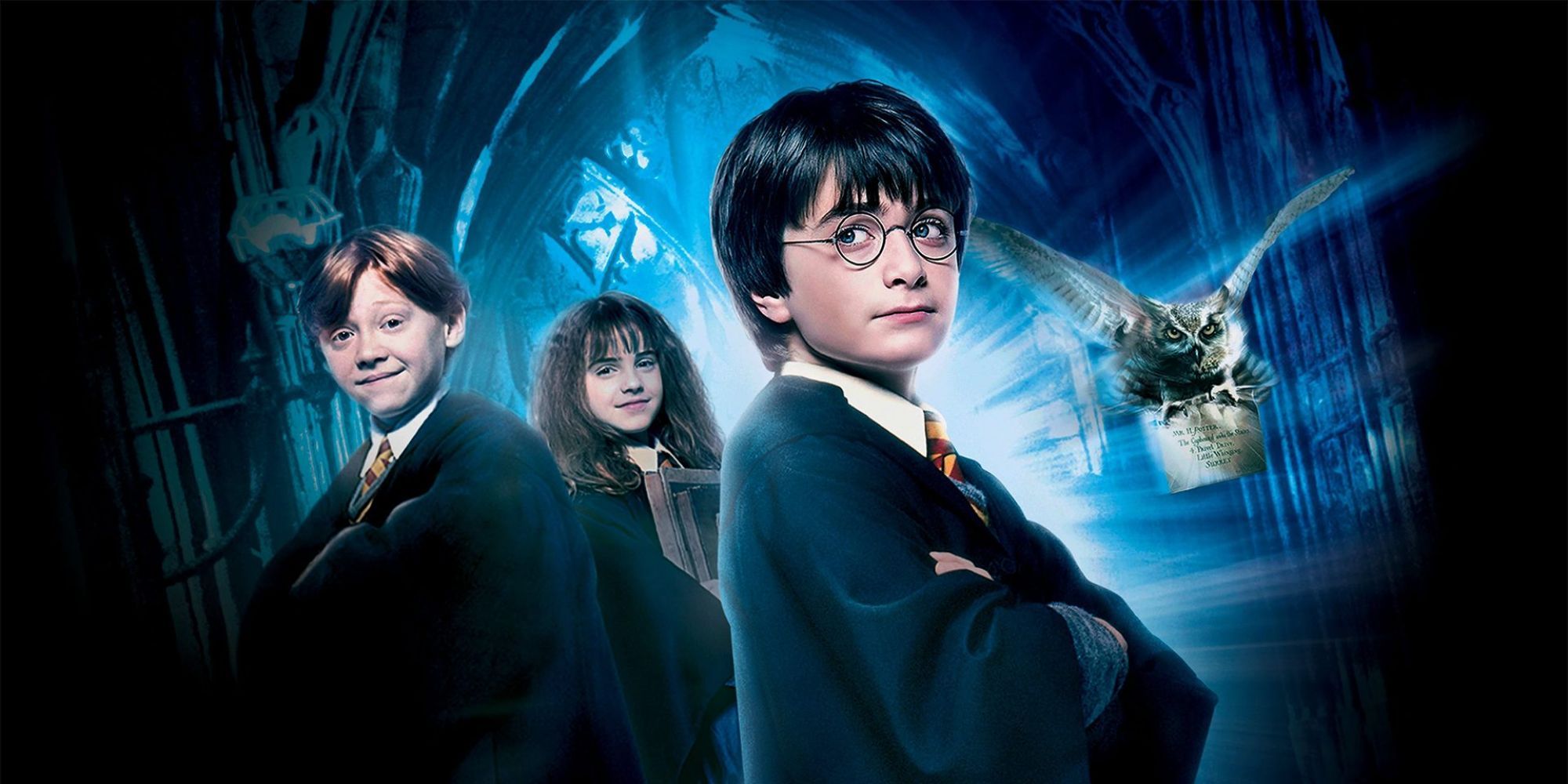 Harry (Daniel Radcliffe), Ron (Rupert Grint), and Hermione (Emma Watson) in a promo image for Harry Potter and the Sorcerer's Stone