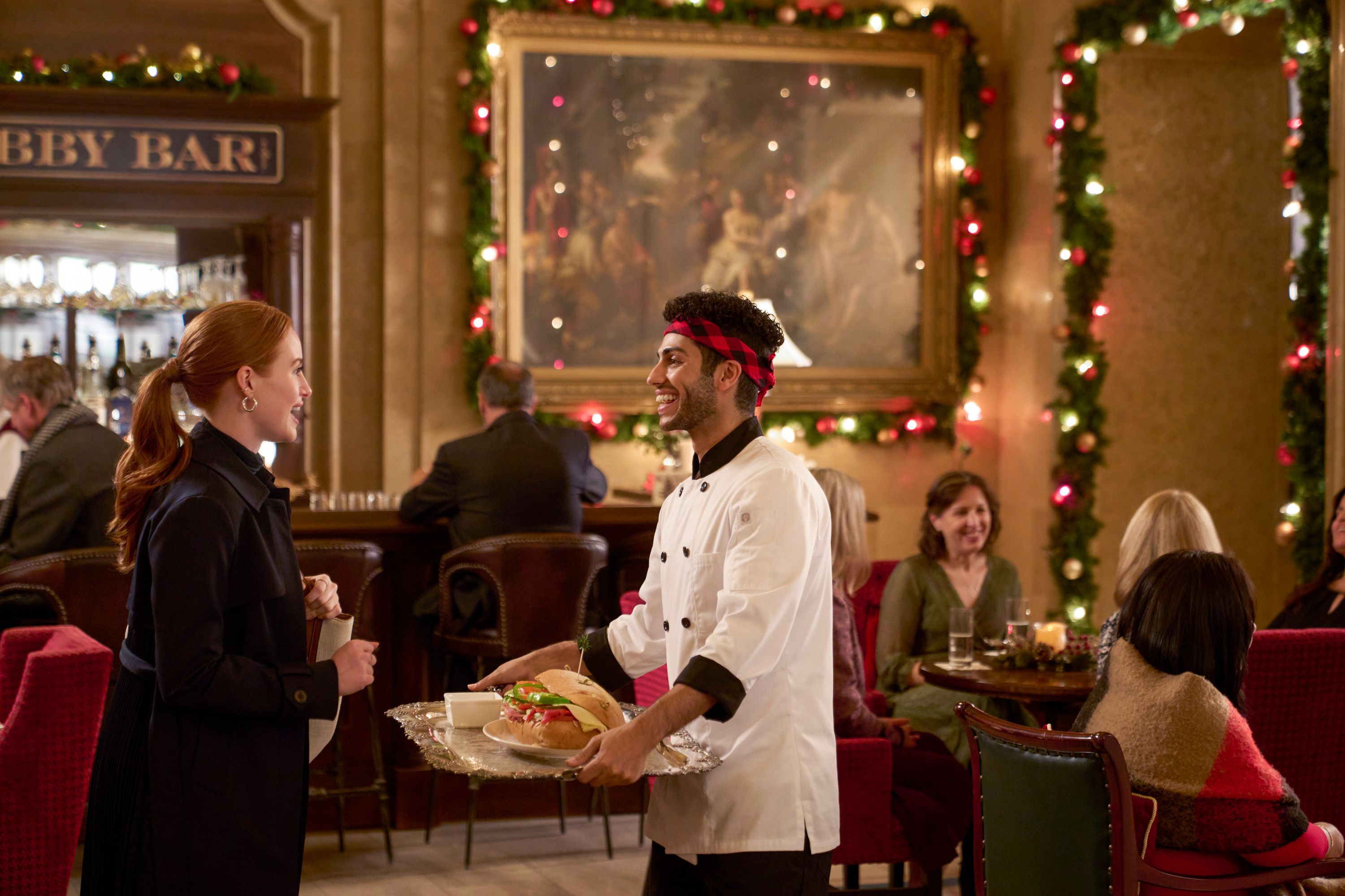 Madelaine Petsch and Meena Massoud in Hotel for the Holidays