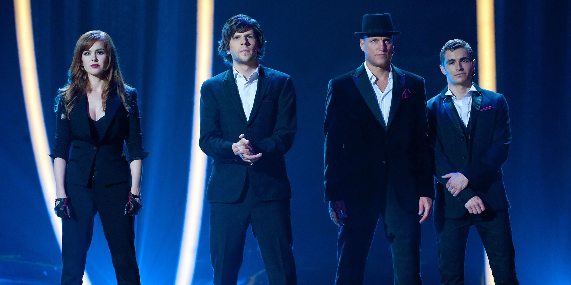 Isla Fisher, Jesse Eisenberg, Woody Harrelson, and Dave Franco as magicians on stage in Now You See Me