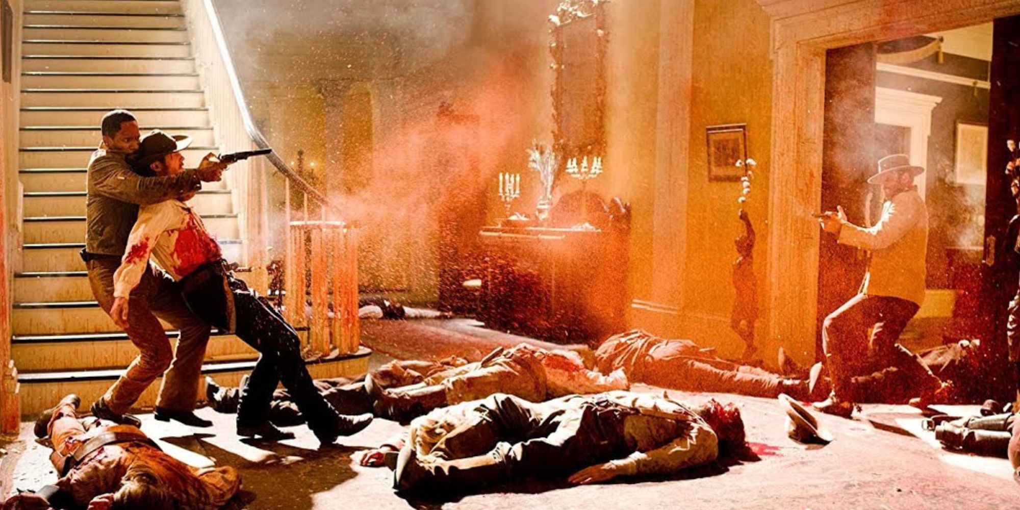 Jamie Foxx holding a man in front of him and firing a gun at another man across the room in Django Unchained