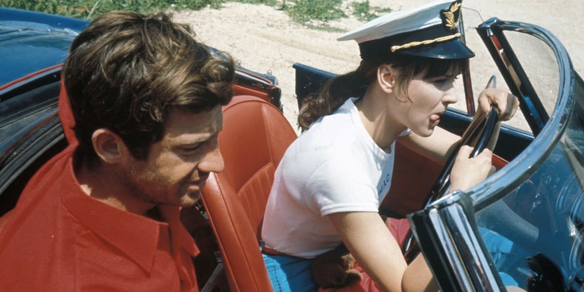 Jean-Paul Belmondo and Anna Karina in 'Pierrot le fou' inside a car.