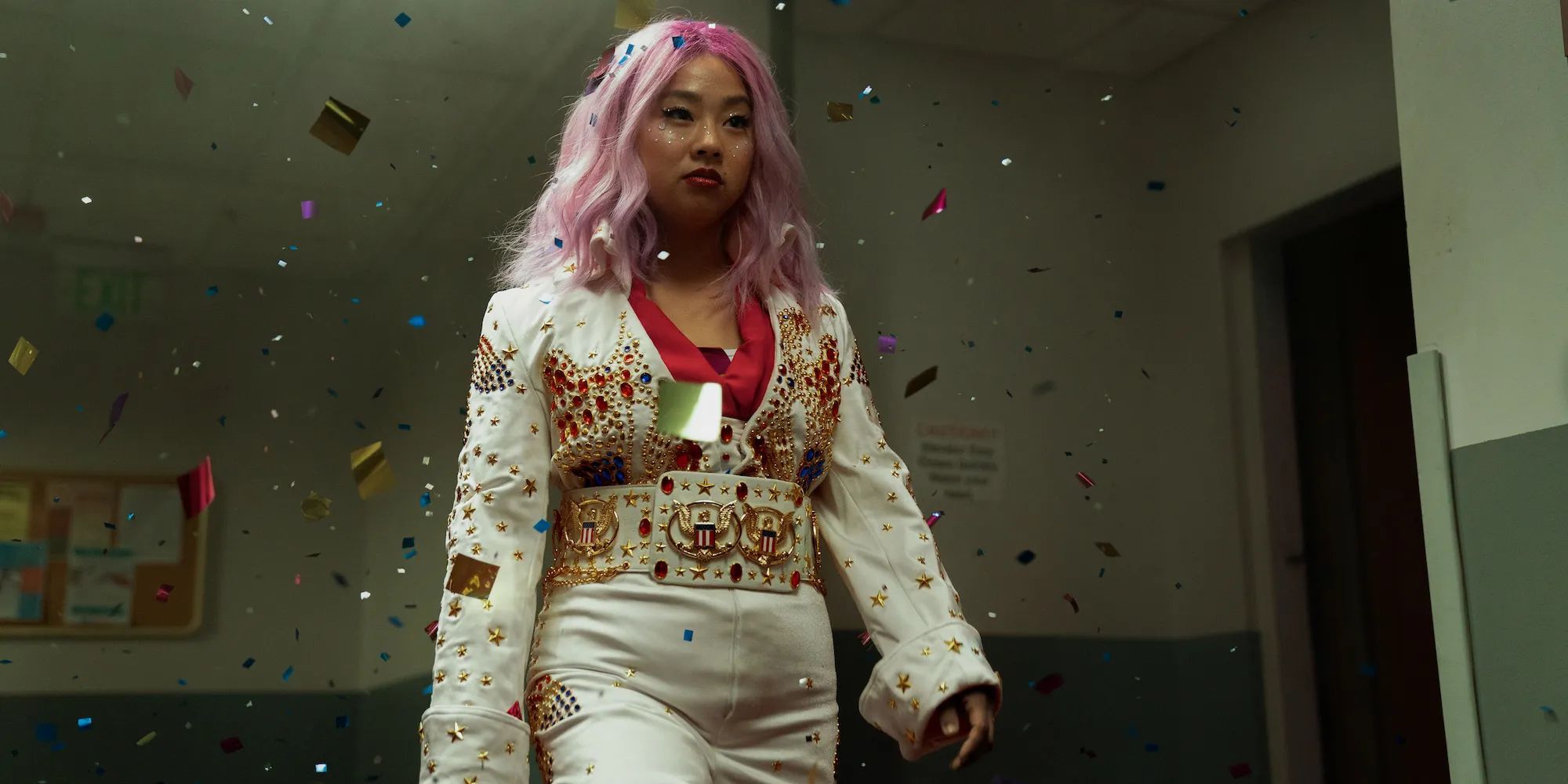 A pink-haired Jobu Tupaki walks through a cloud of confetti