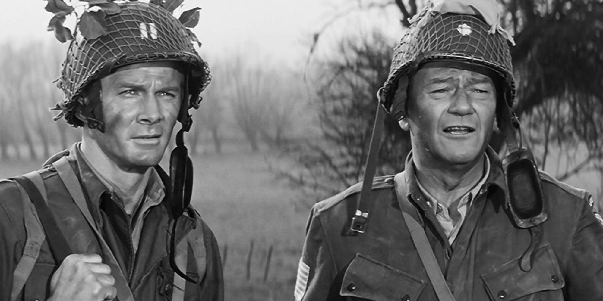John Wayne standing next to another soldier in The Longest Day