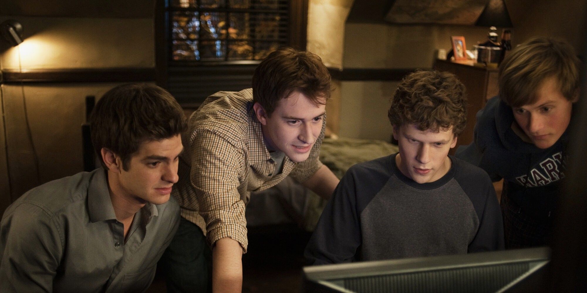 Joseph Mazzello, Jesse Eisenberg, Andrew Garfield, and Patrick Mapel in 'The Social Network'