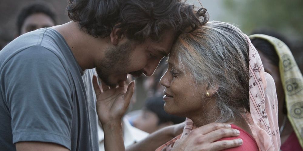 A mother and her son embrace each other after being reunited
