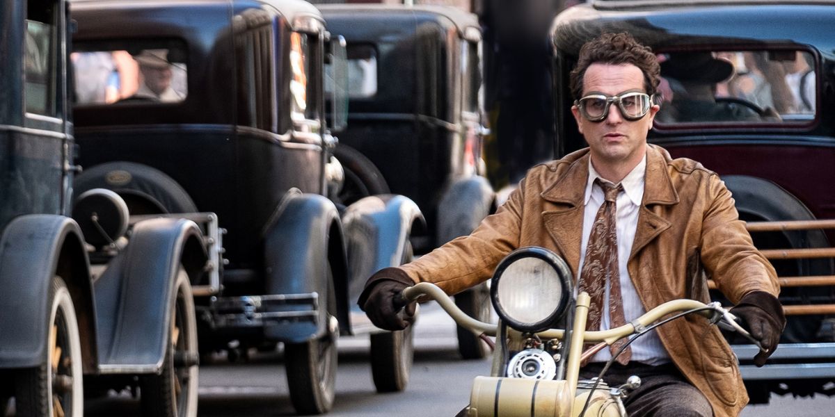Matthew Rhys as Perry Mason on a motorcycle in Season 2