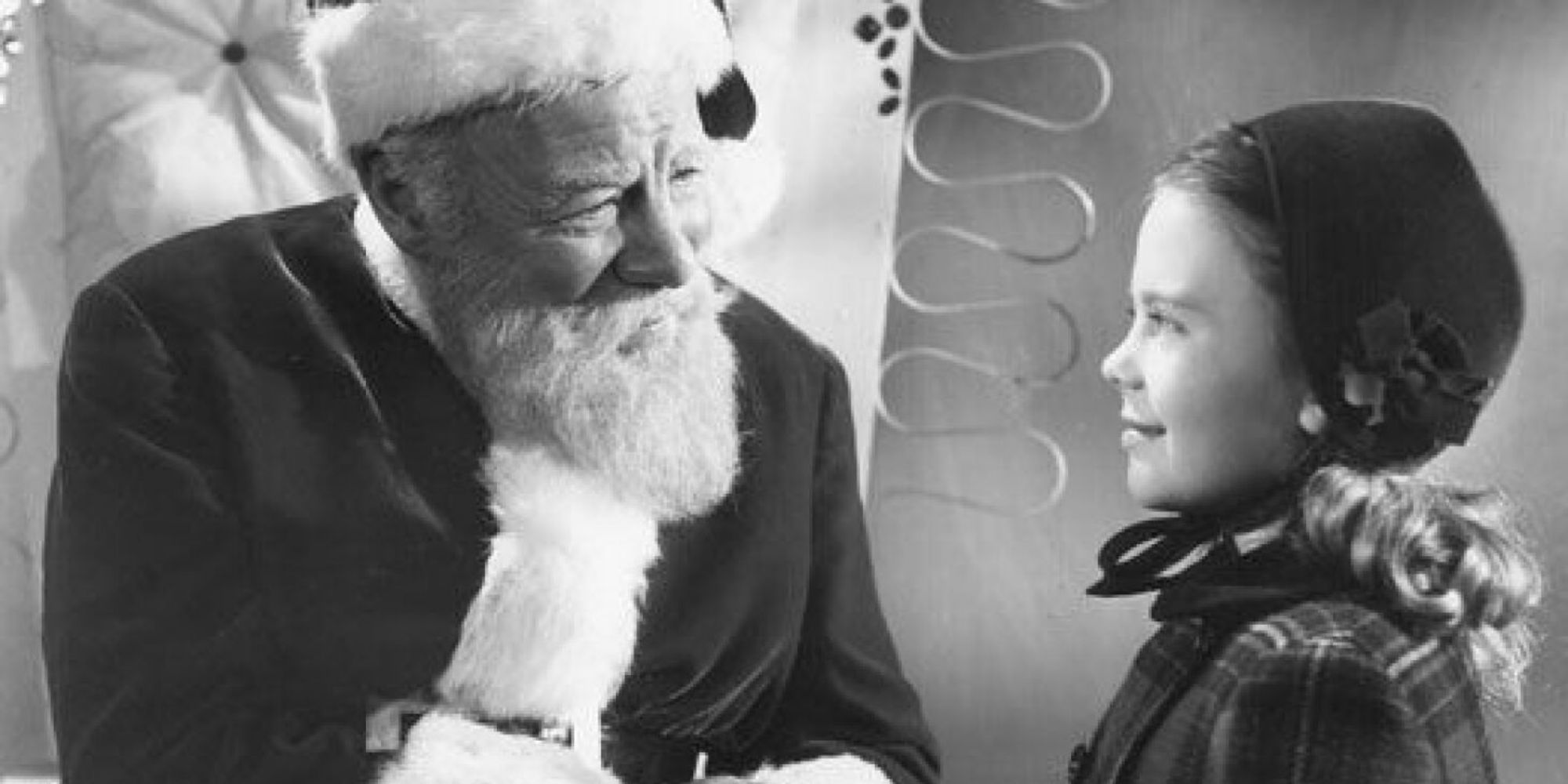 Santa Clause talking to a young girl in Miracle on 34th Street