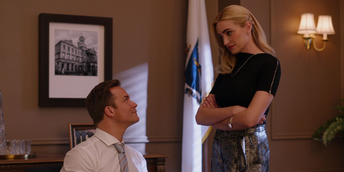 Paul, played by Scott Porter, with Georgia, played by Brianne Howey, in the Mayor's office in Ginny & Georgia Season 1.