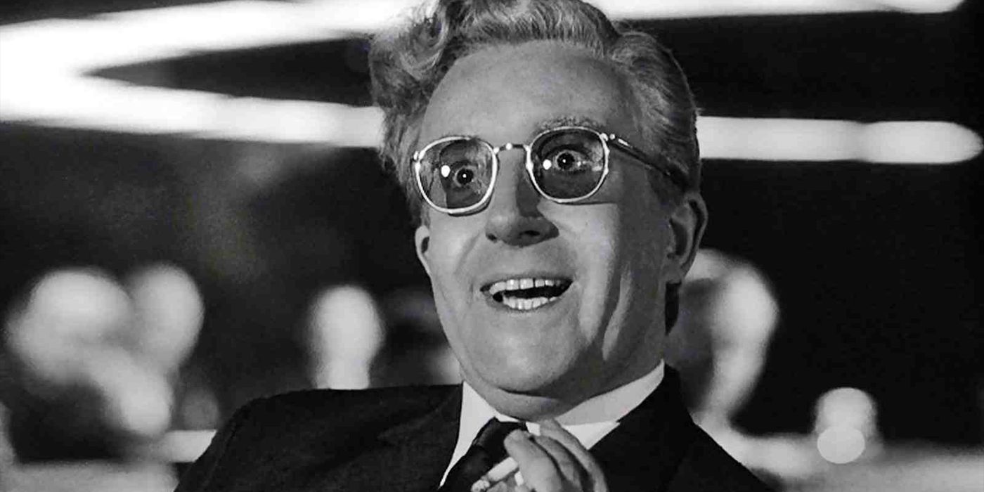 Peter Sellers as Dr. Strangelove smiling with a deranged expression on his face in Dr. Strangelove.