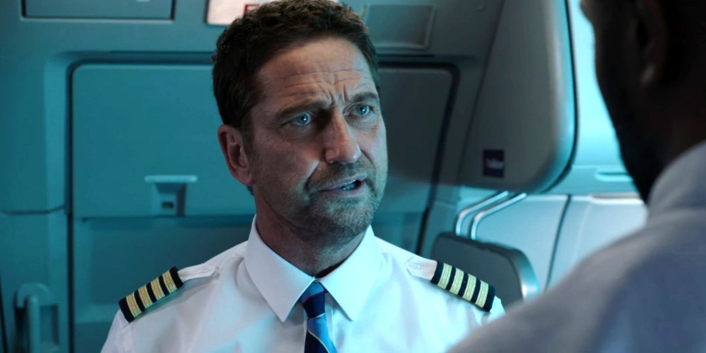 Gerard Butler as Brodie talking to someone off camera in Plane