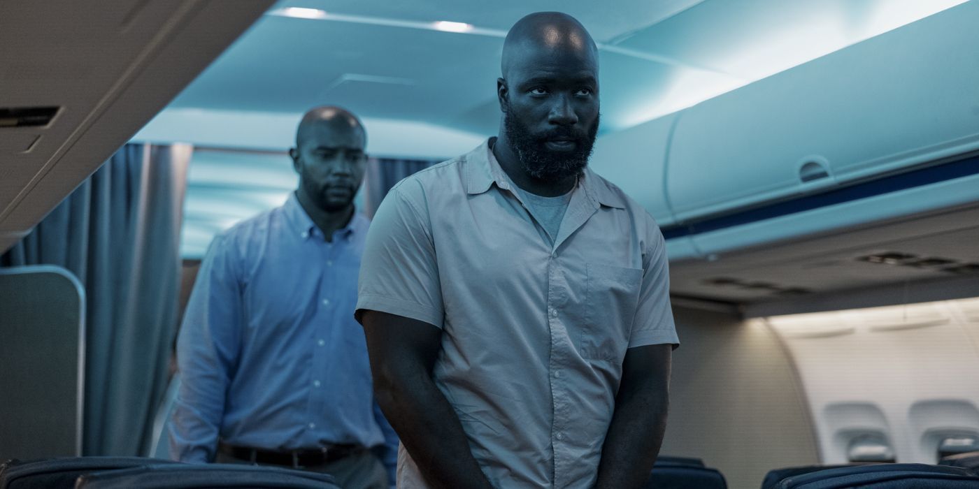 Mike Colter on a plane in handcuffs in Plane