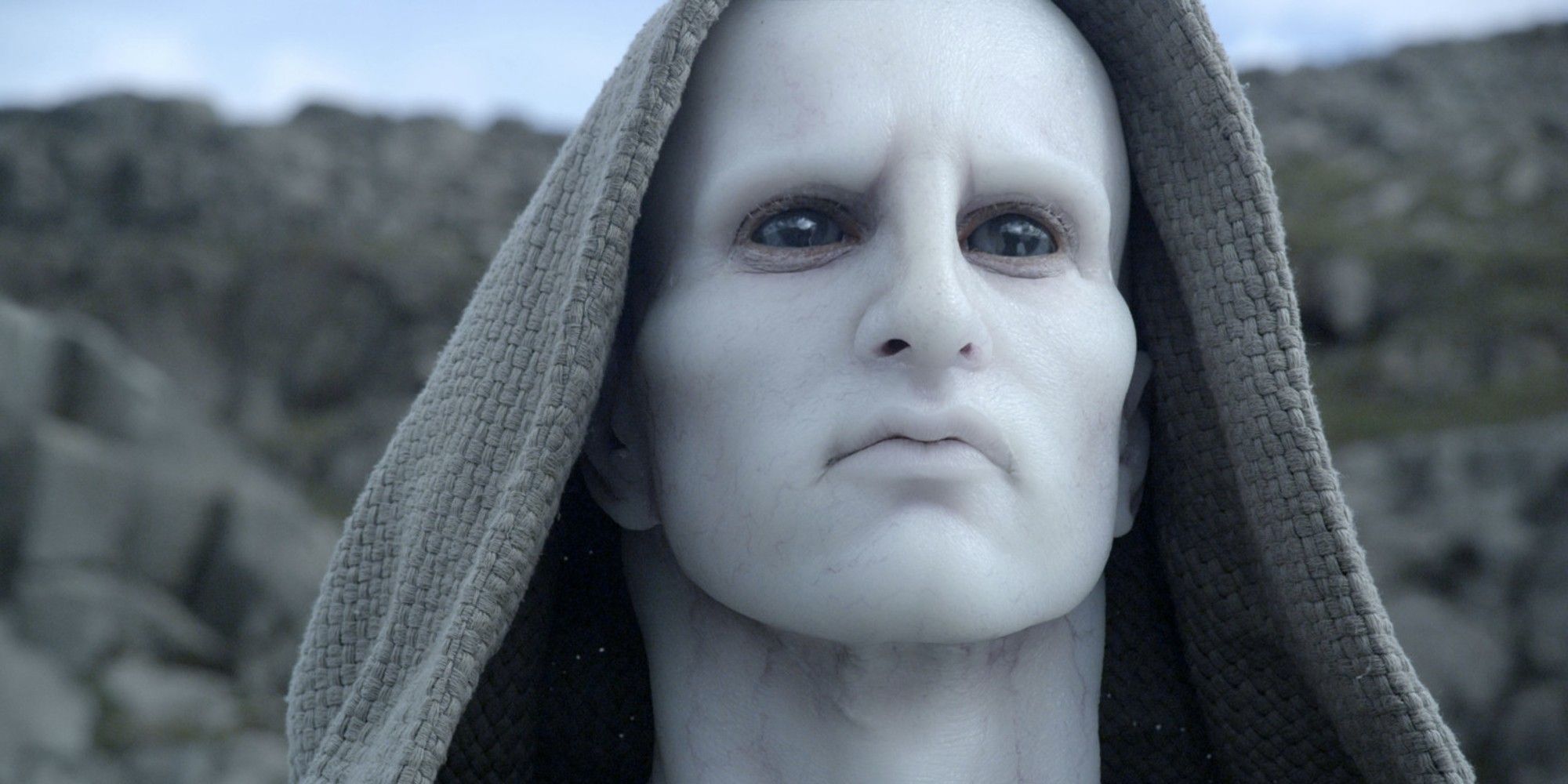 An all-white alien wearing a hood in Prometheus.