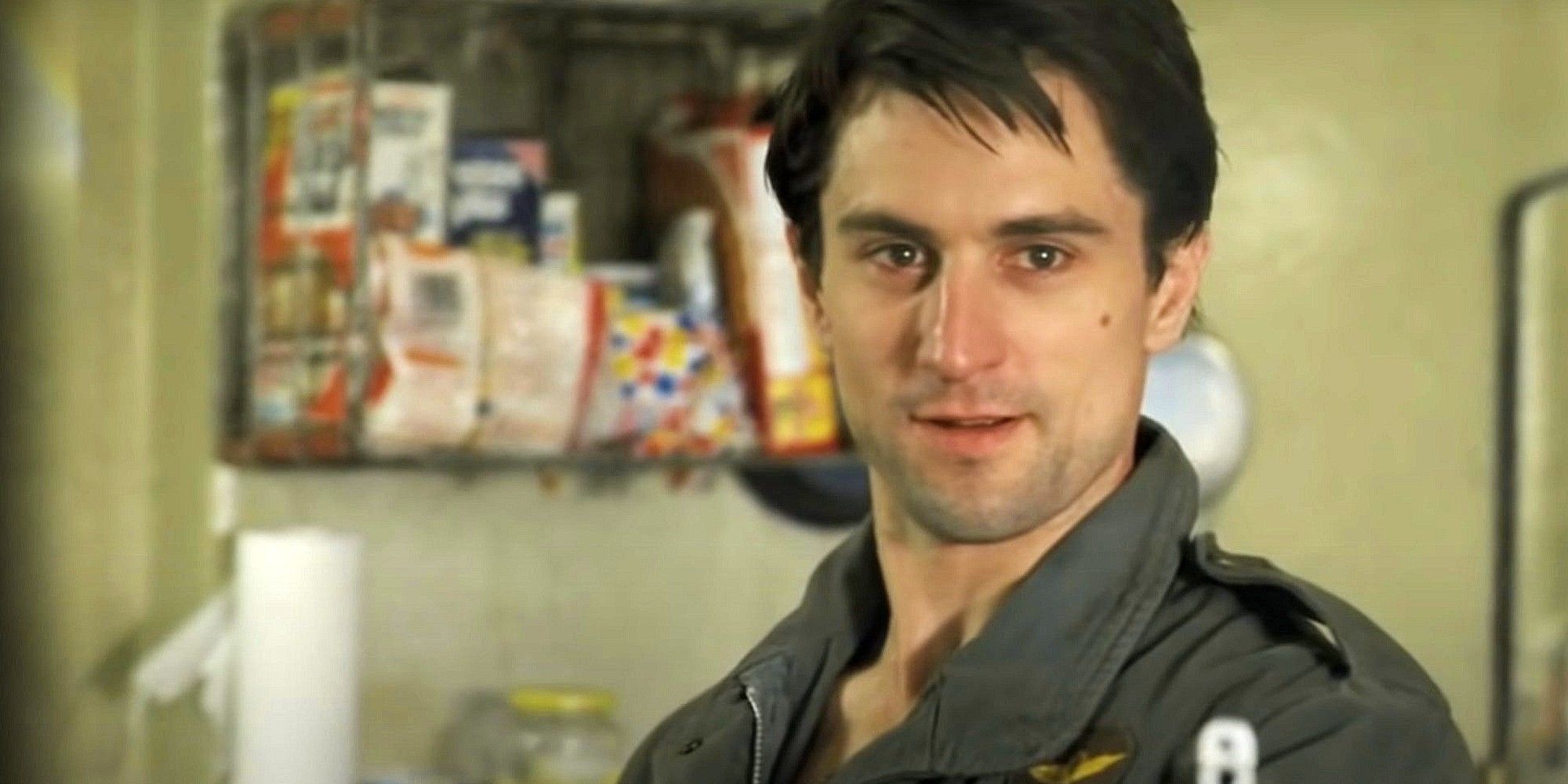 Travis Bickle looking intently at something in 'Taxi Driver'