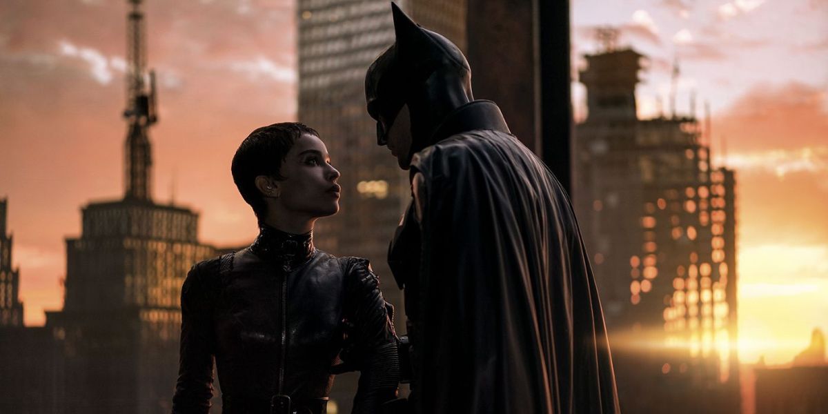 Robert Pattinson and Zoë Kravitz as Batman and Catwoman looking at each other in Matt Reeves' The Batman