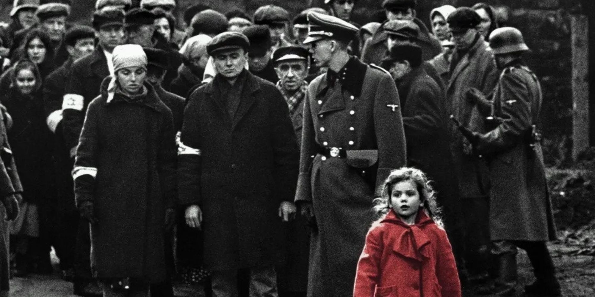 The girl with the red coat walking among a large crowd in Schindler's List