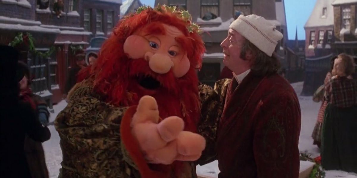 Michael Caine as Scrooge talking to The Ghost of Christmas Present in The Muppets Christmas Carol