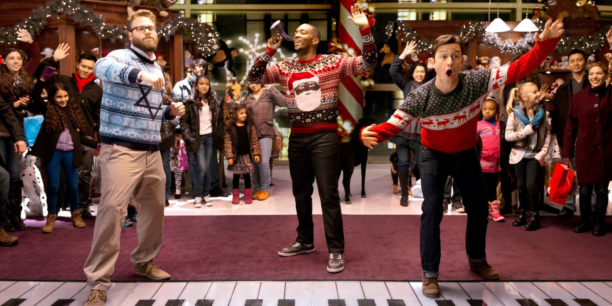 Three friends in a department store playing on the floor piano