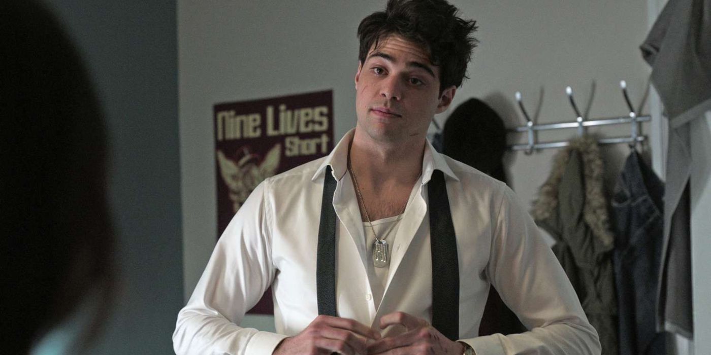 Noah Centineo as Owen, buttoning up his shirt while looking disheveled in The Recruit