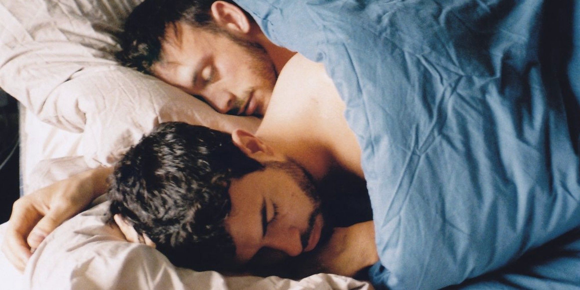 Tom Cullen and Alex New in bed together sleeping in 'Weekend'