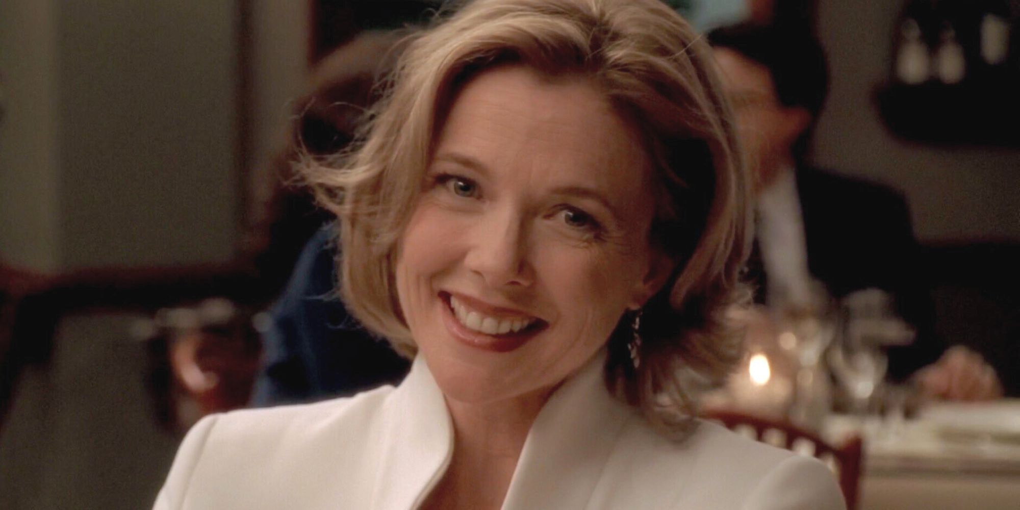 Annette Bening smiling looking straight at the camera in The Sopranos