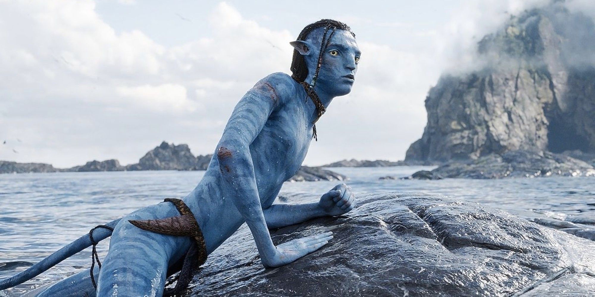 Lo'ak the Na'vi teen (played by Britain Dalton) riding a whale-like creature in the ocean in Avatar: The Way of Water