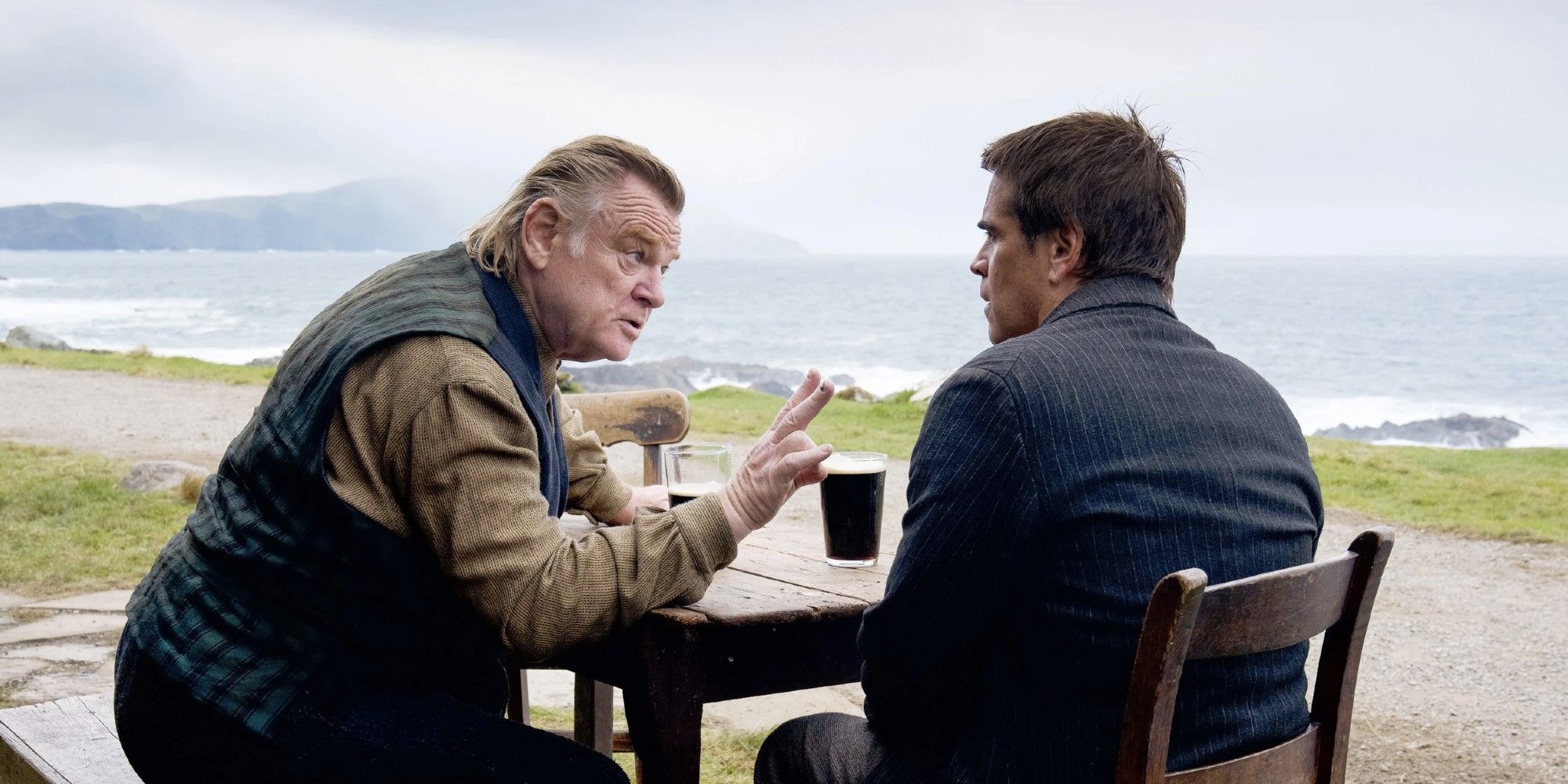 Brendan Gleeson and Colin Farrel as Colm and Podrick talking while drinking beer in 'The Banshees of Inisherin'