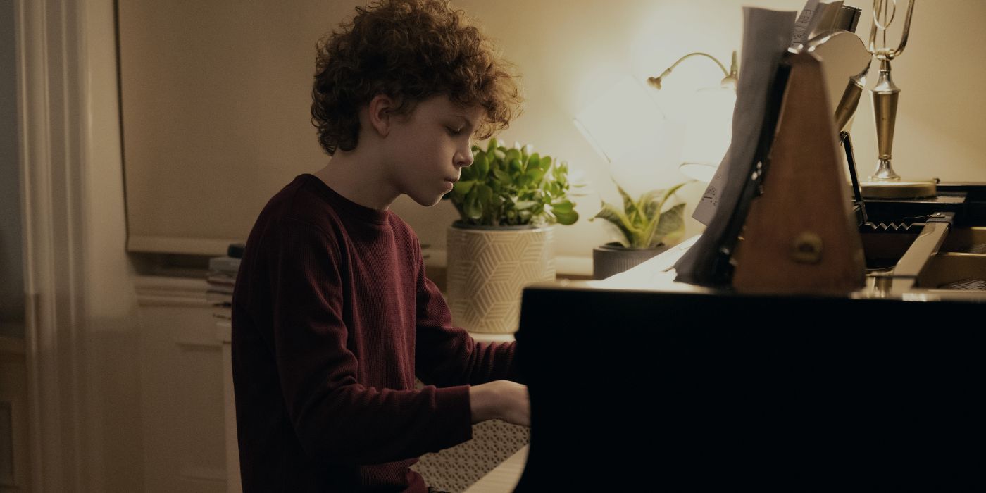 Colin O'Brien as Edward playing the piano in Dear Edward