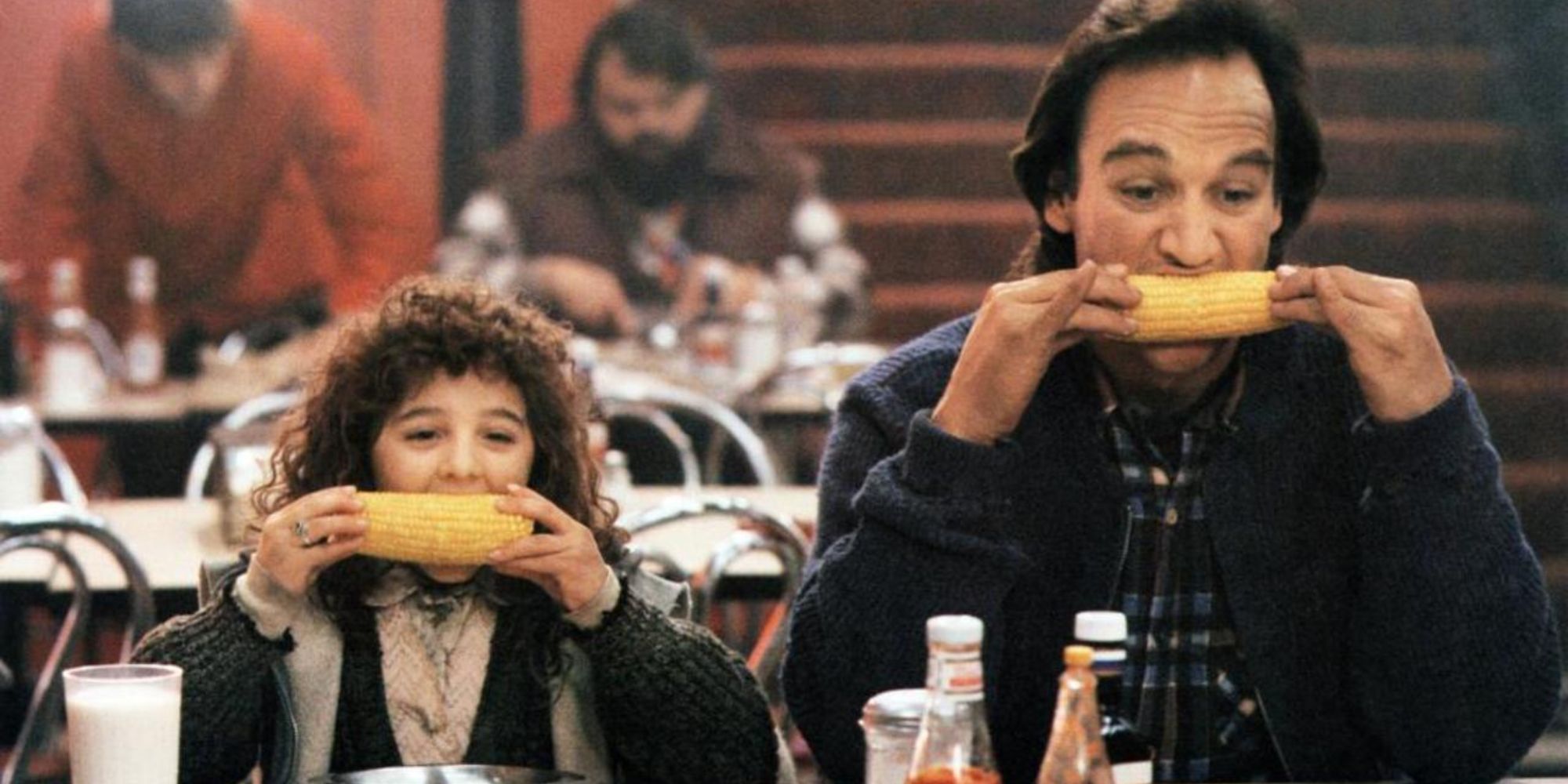 Bill and Curly Sue eating corn in Curly Sue