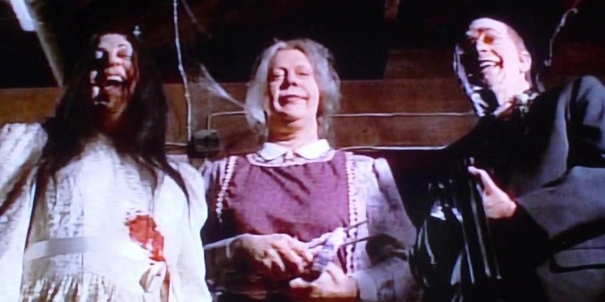 The Brackett family looking down with evil smiles on Tales From the Crypt episode "Death of Some Salesmen."