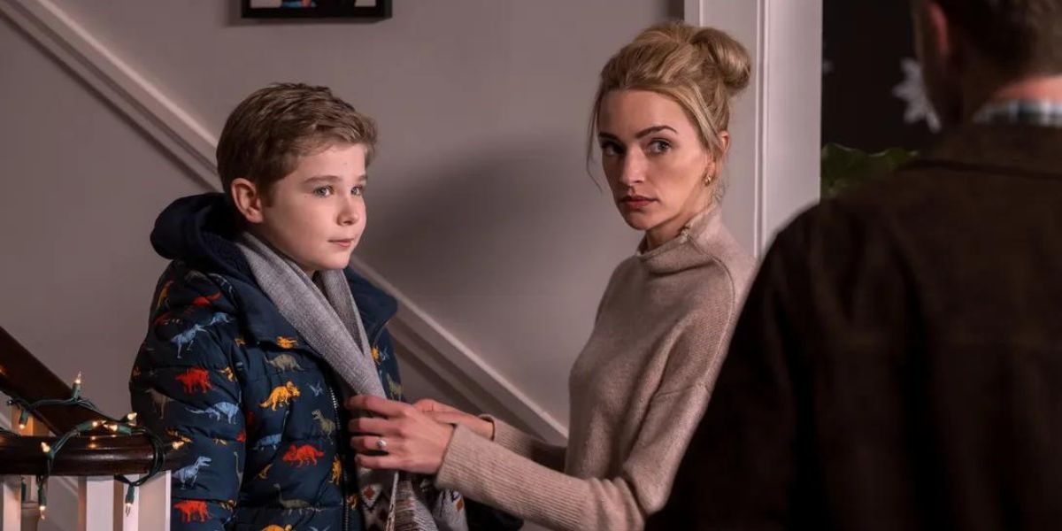 Georgia, played by Brianne Howey, putting on Austin's, played by Diesel Le Torraca, scarf in 'Ginny & Georgia' Season 2.