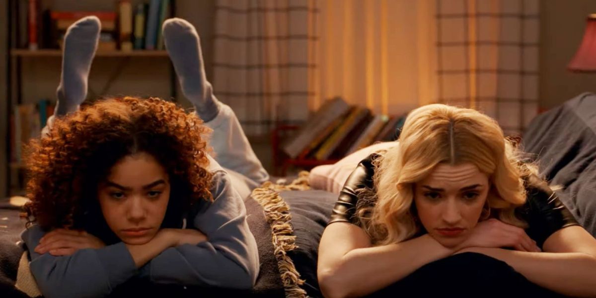 Ginny (played by Antonia Gentry) and Georgia (played by Briann Haway) lie in bed next to each other looking depressed in Season 2 of Ginny and Georgia.