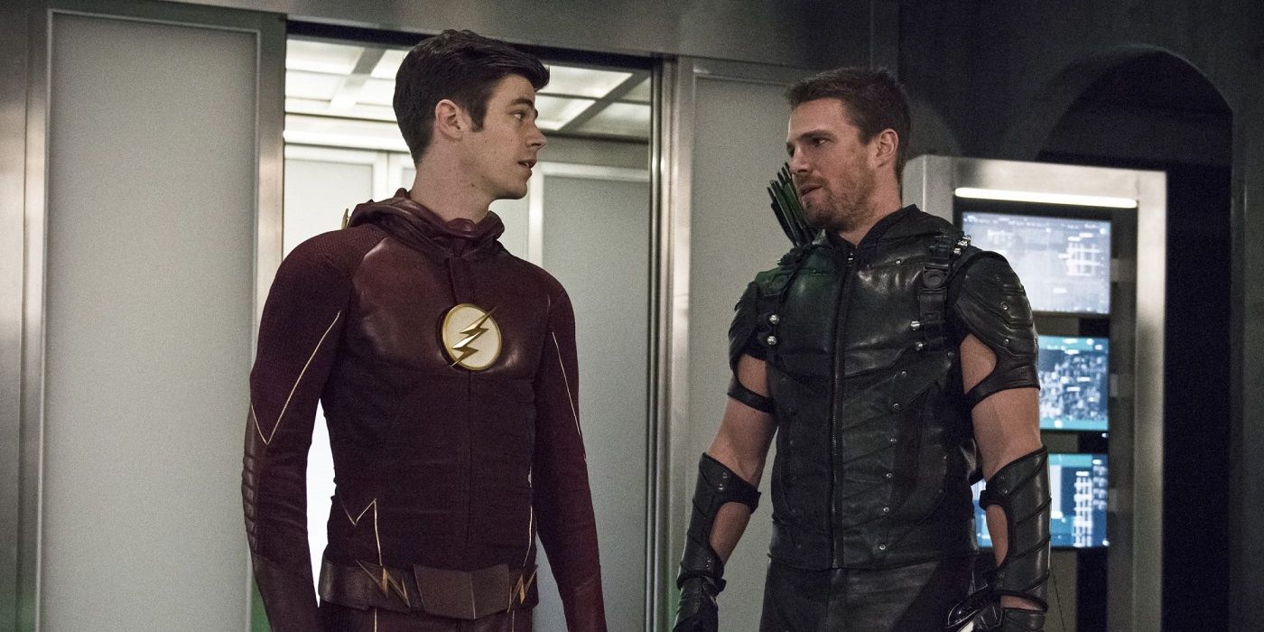 grant gustin as barry allen and stephen amell as oliver queen in the arrowverse