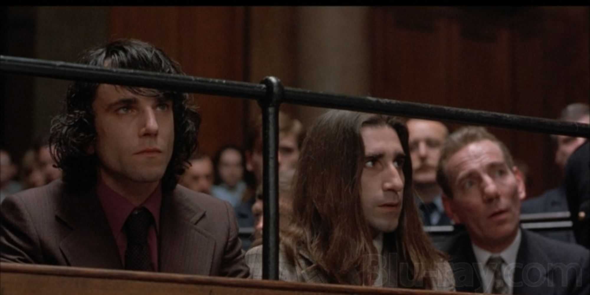 Gerry Conlon sitting in an audience looking ahead In the Name of the Father