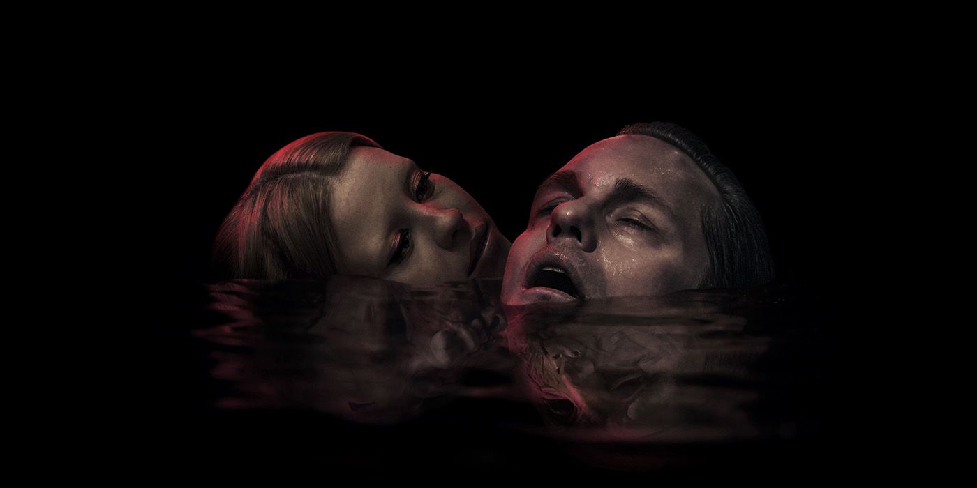 A young woman and a man sinlking in a pool in the poster for Infinity Pool.