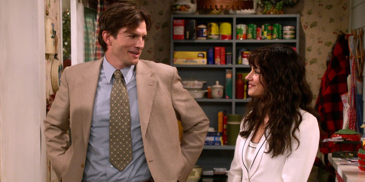 Mila Kunis as Jackie and Ashton Kutcher as Kelso smiling at each other in 'That 90s Show'