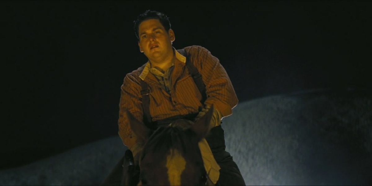 Jonah Hill as Bag Head #2 riding a horse at night in Django Unchained (2012) 