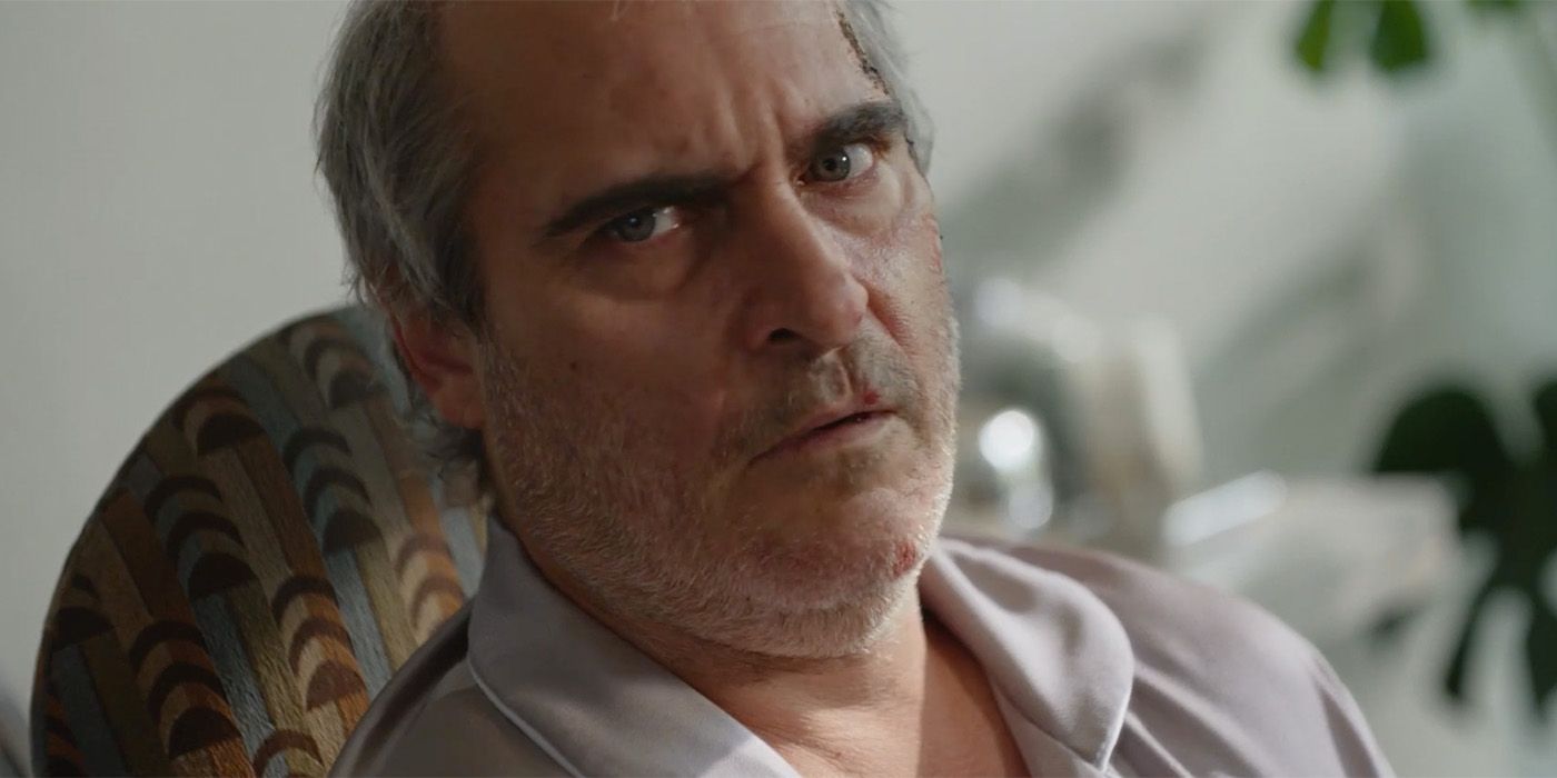 Close-up of Joaquin Pheonix as Beau Wasserman looking very concerned in a chair in Beau Is Afraid