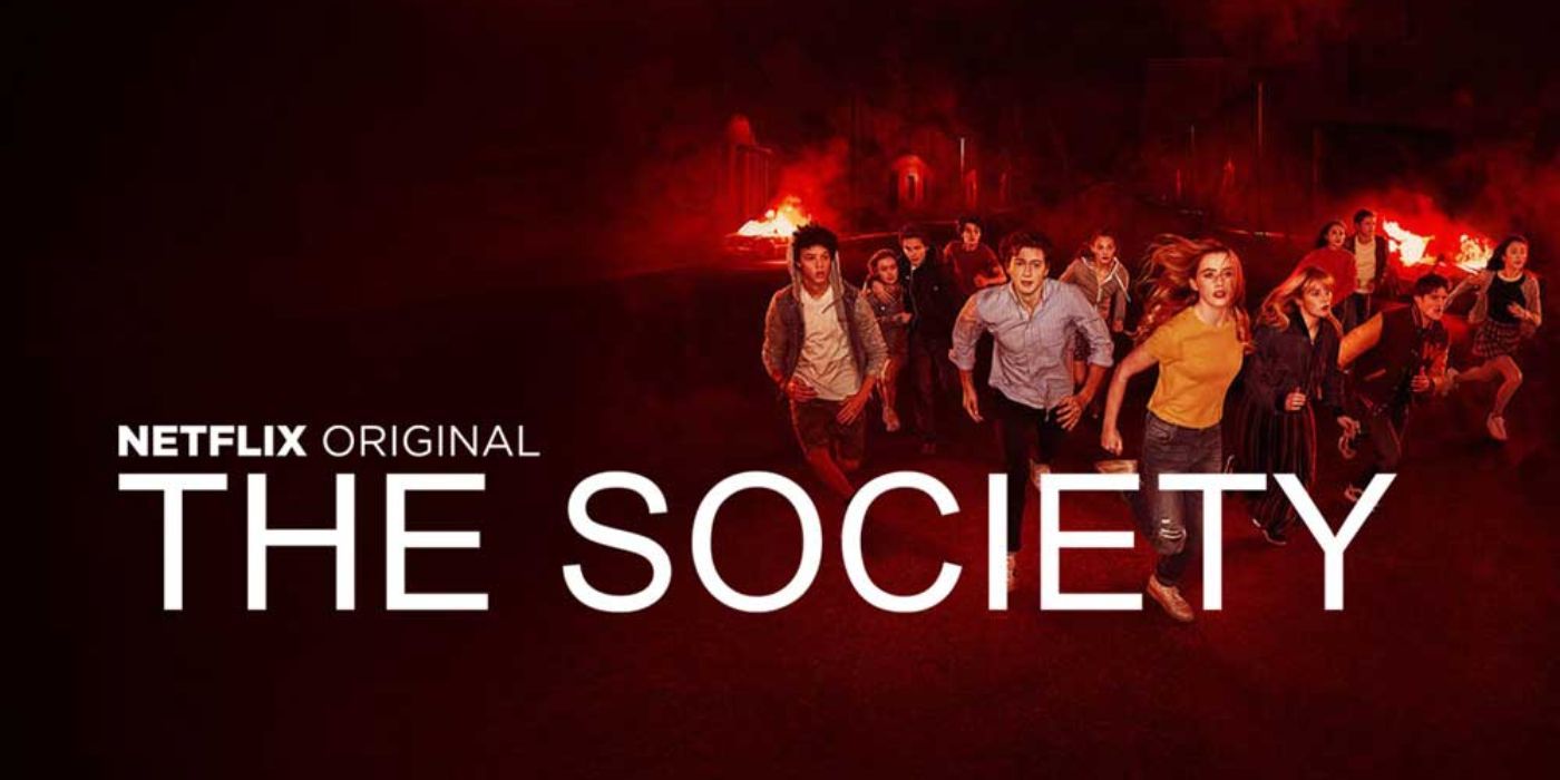 An official image of the cast of Netflix's 'The Society' running away from a fire in the distance