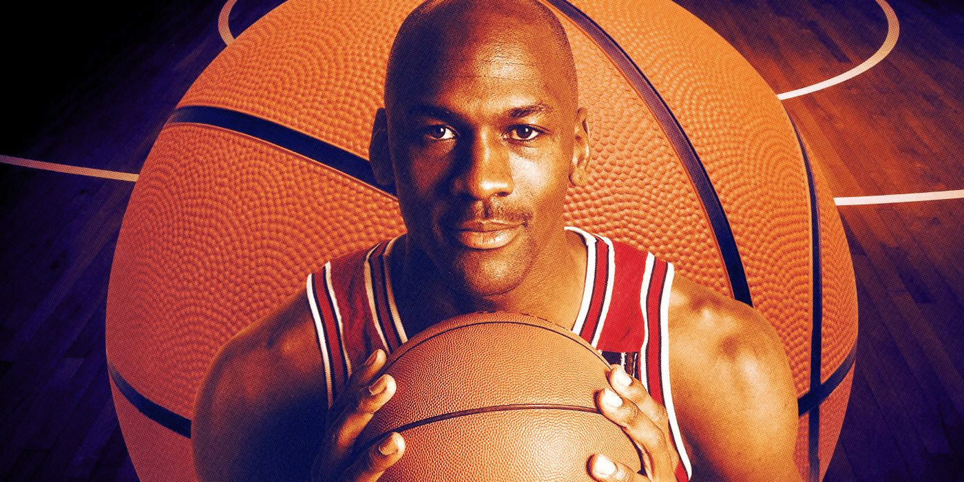 michael jordan wears his chicago bulls jersey while holding a basketball