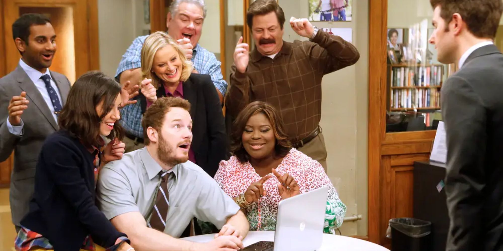 The cast of Parks and Recreation celebrating
