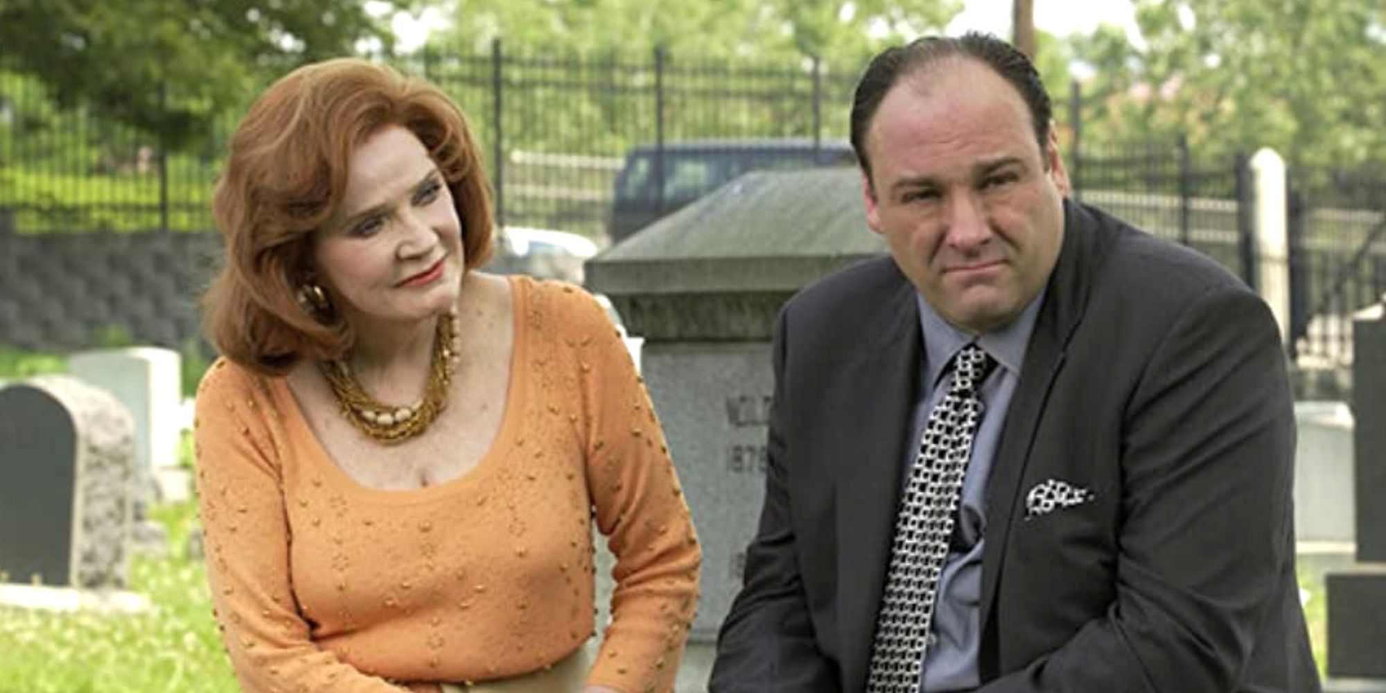 Polly Bergen sitting next to James Gandolfini looking at him while he looks away in the opposite direction in The Sopranos