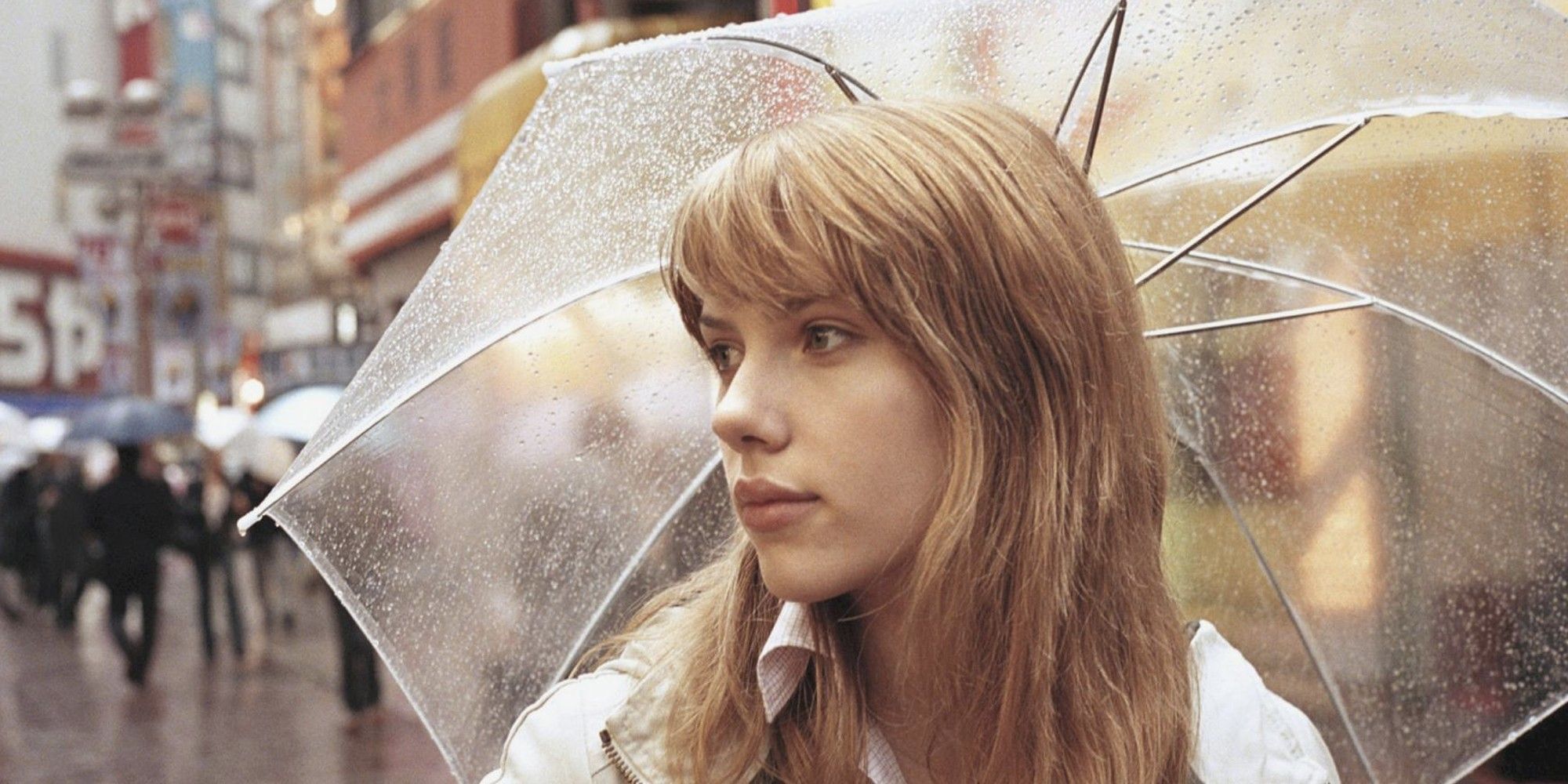 Scarlett Johansson holding an umbrella in 'Lost in Translation' (2003)