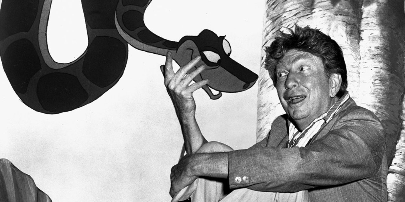 Sterling Holloway posing with his character from The Jungle Book, Kaa