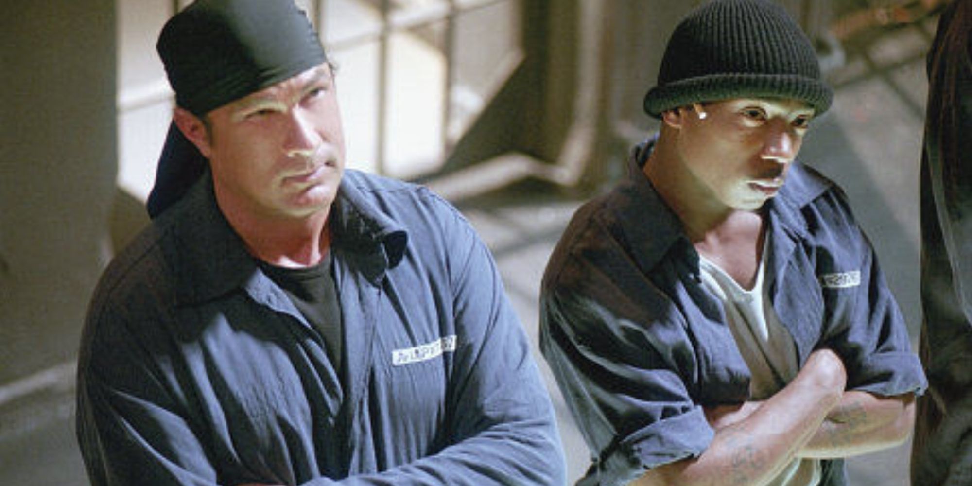 Steven Seagal and Ja Rule in prison uniforms in Half Past Dead