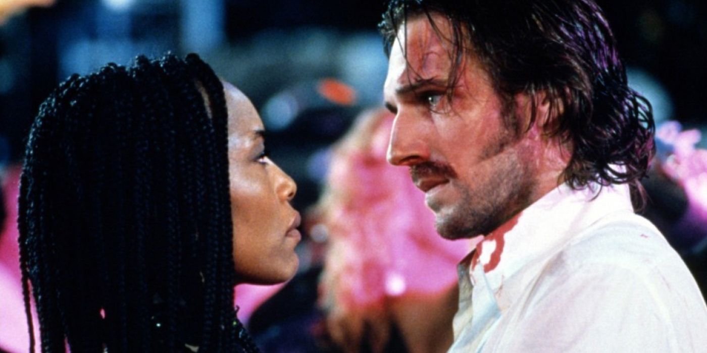 Angela Bassett as Mace staring at Ralph Fiennes as Lenny in Strange Days (1995)