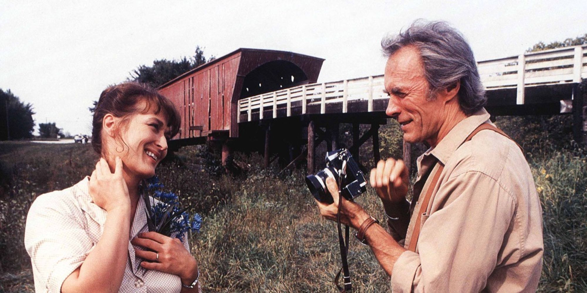 The Bridges of Madison County’ clint eastwood holding a camera with franceca Johnson