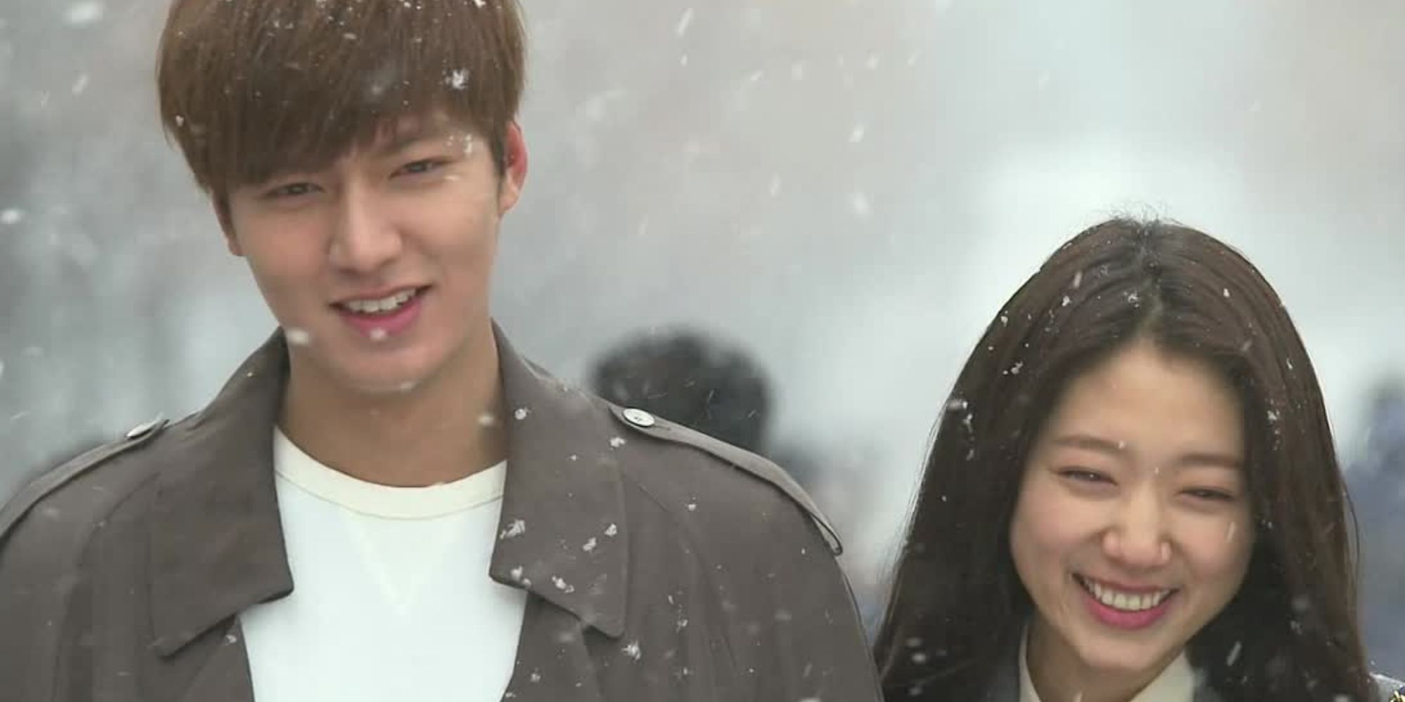 Kim Tan and Cha Eun Sang from The Heirs smiling in the snow.