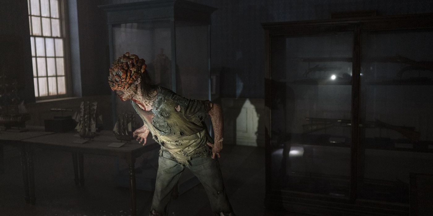 A former person infected with Cordyceps screeching in a dark room in The Last of Us.