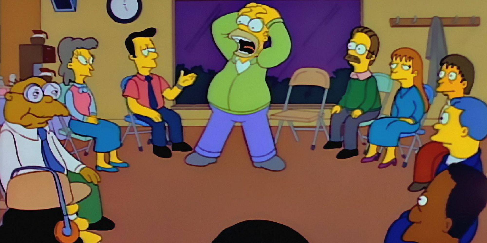 Homer has his hands on his head and screams as others sit around in a circle in folding chairs in The Simpsons.